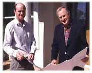 Dennis and David Gamble reviewing a set of house plans